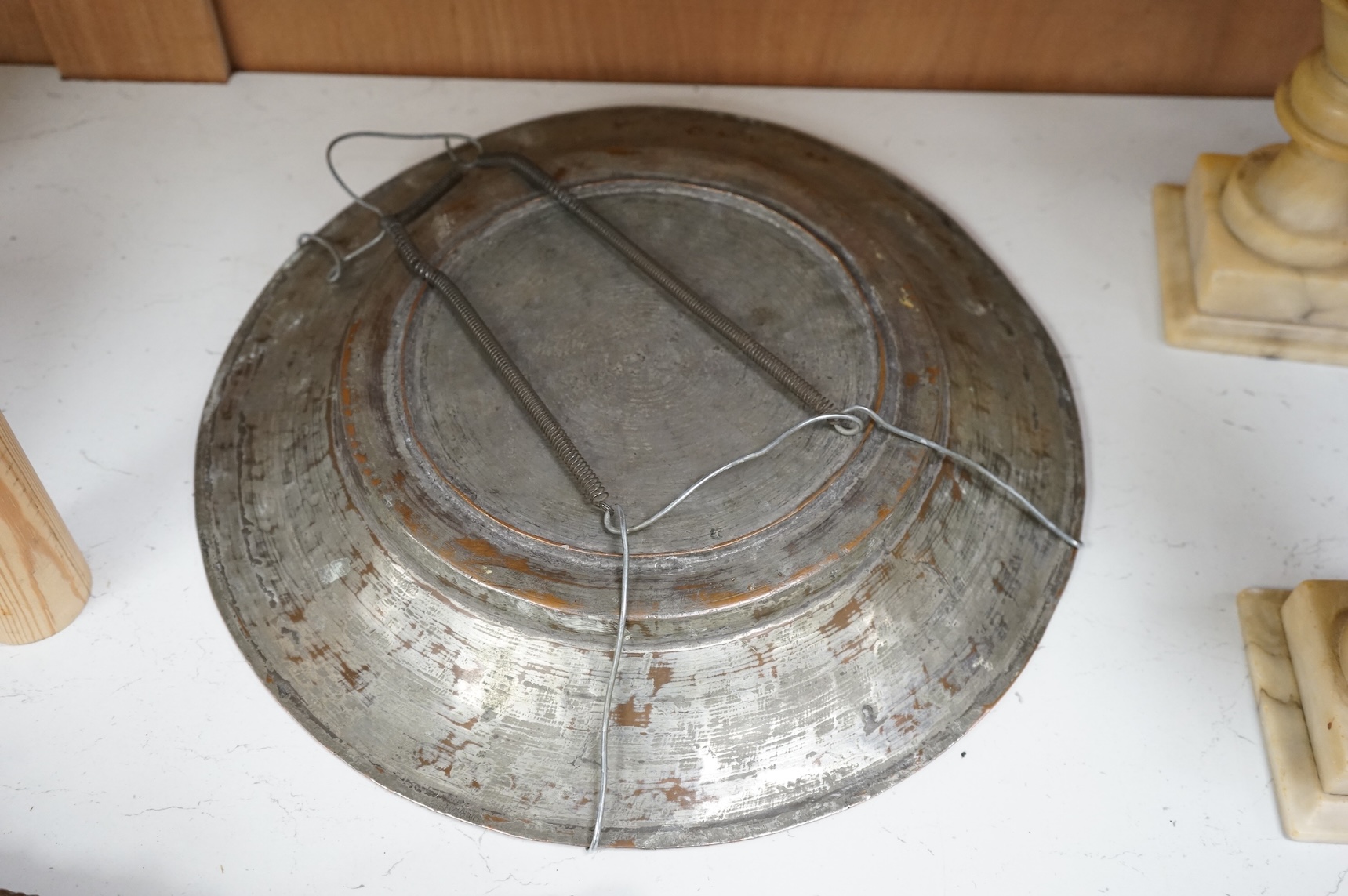 An 18th century Persian tinned copper dish, 34cm diameter.